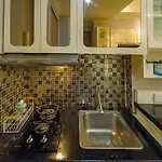 Modern 2Br Green Pramuka City Apartment Near Shopping Center By Travelio