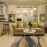 Modern 2Br Green Pramuka City Apartment Near Shopping Center By Travelio