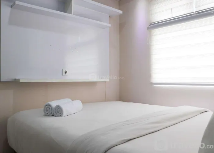 Modern 2Br Green Pramuka City Apartment Near Shopping Center By Travelio